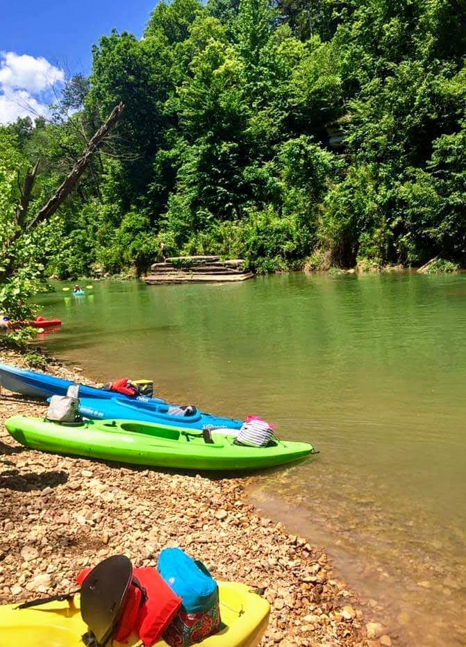 Kayaks on the river bank